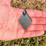 size of Shungite rhombus pendant and hand