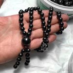 mala necklace size shown in hand