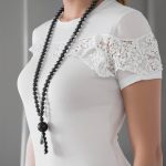 mala necklace worn by woman