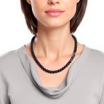 Female model wearing necklace close-up