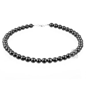 Handmade black beads chain with 10mm shungite beads on decorative background