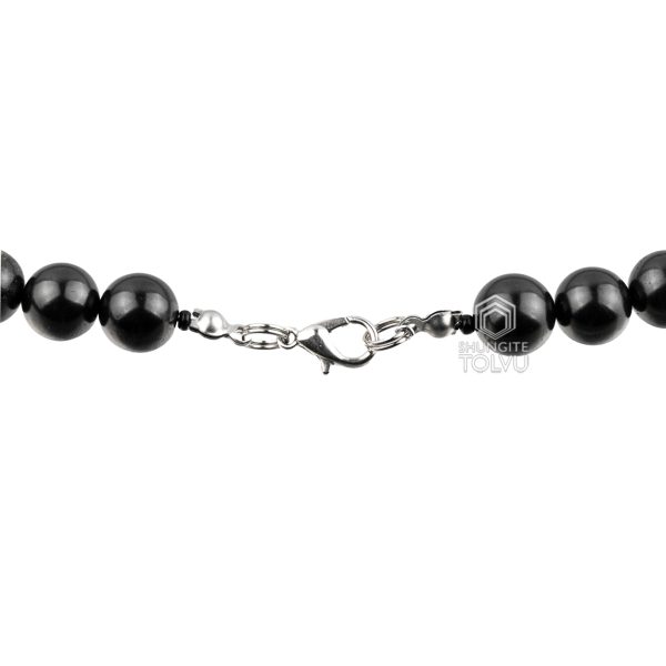 Close-up of polished 10mm shungite beads