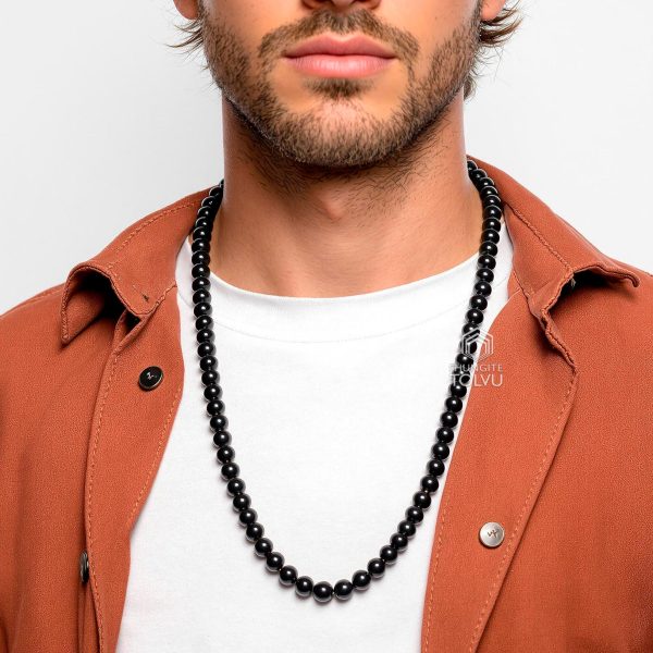 Black beads chain on man’s neck