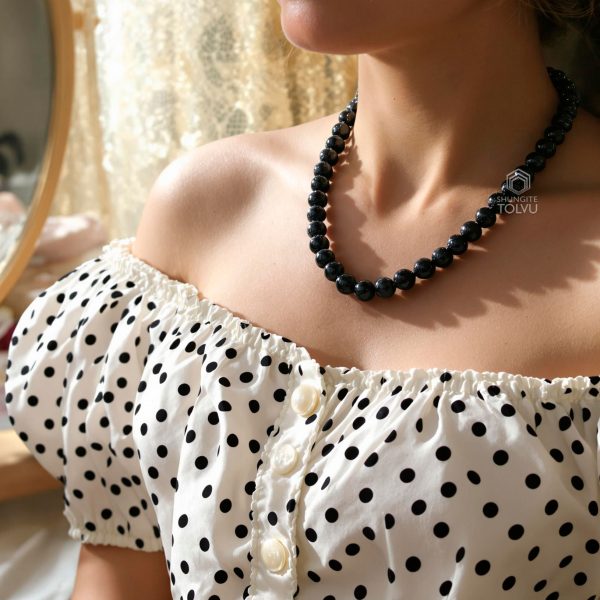 Woman in black beads chain necklace