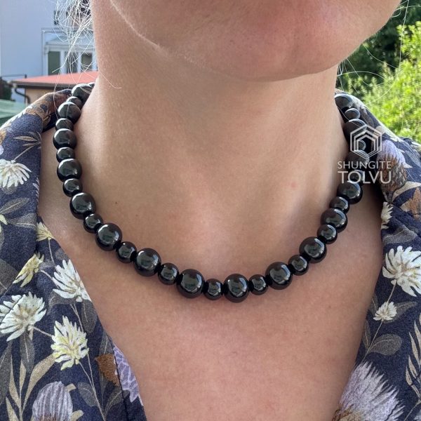 Handmade black bead necklace on woman