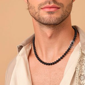 man wearing short handmade black shungite necklace