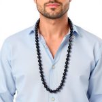 man wearing long men's black necklace beads
