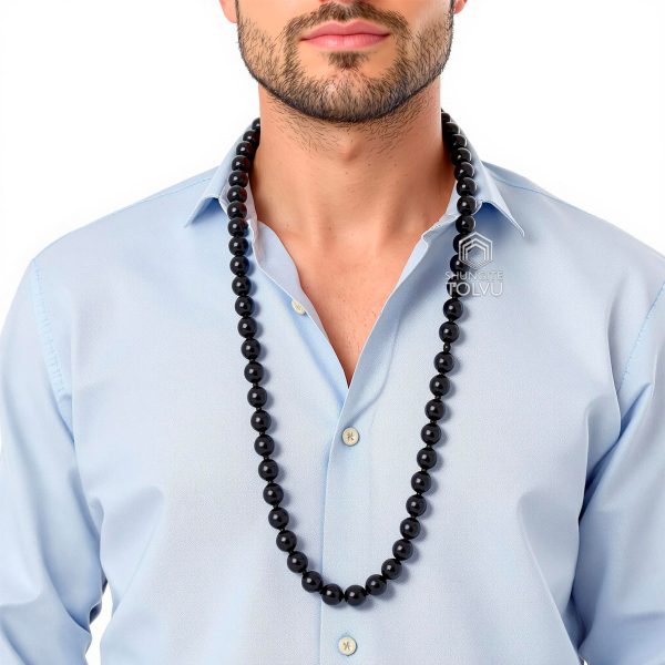 man wearing long men's black necklace beads