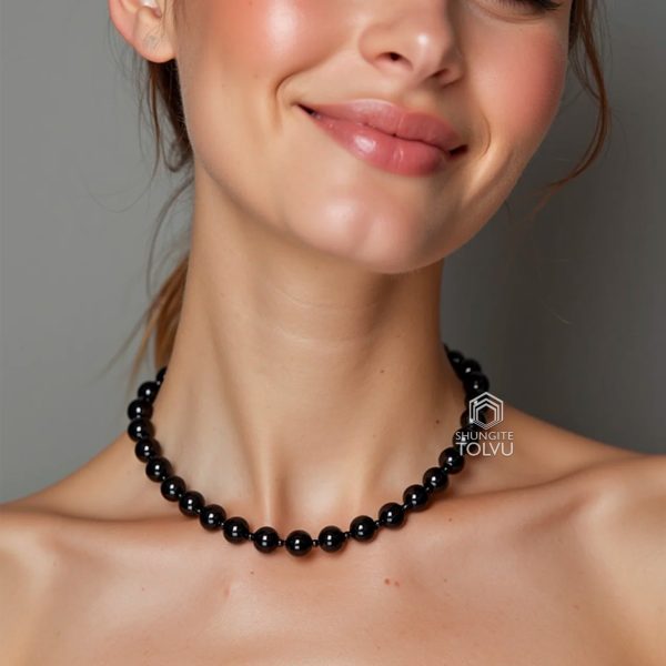 woman wearing short black shungite necklace
