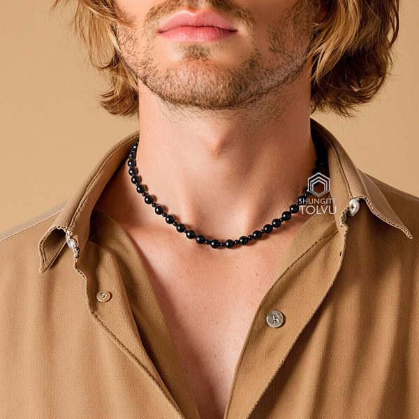 Black diamond bead necklace worn by man