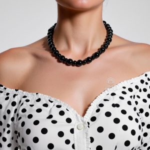 Black diamond bead necklace worn by woman